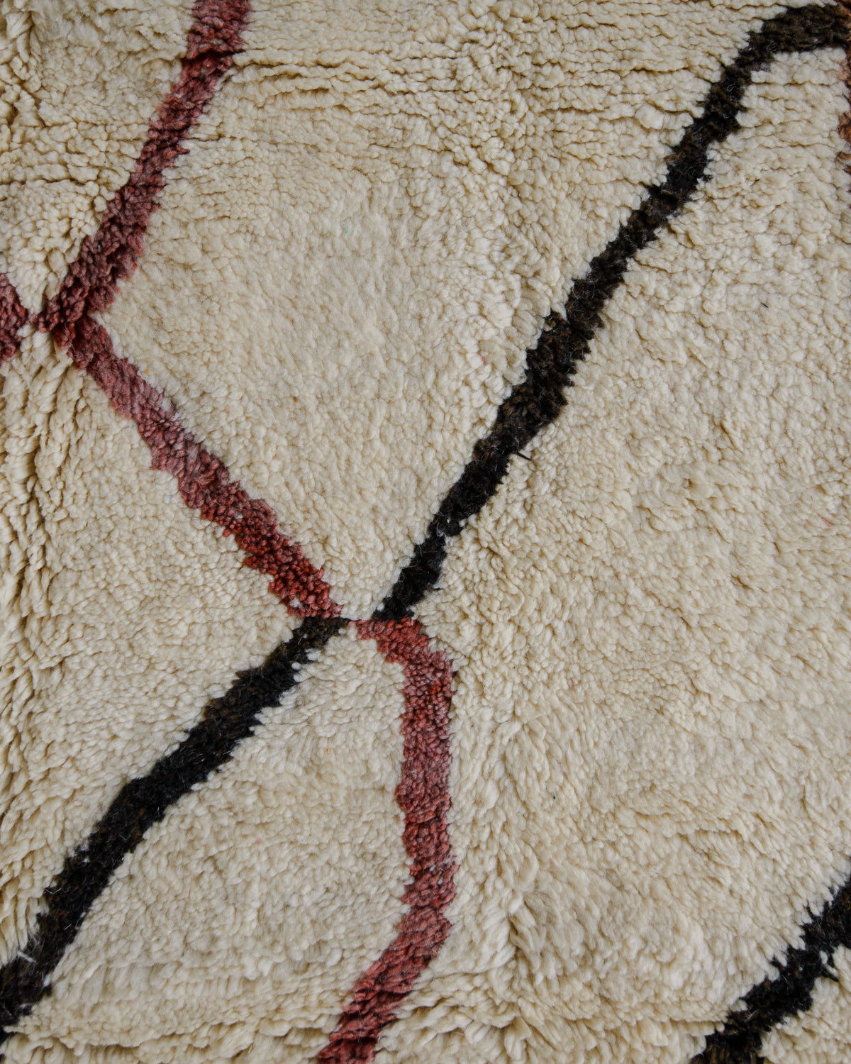 Detail of wool rug showing some discolouration.